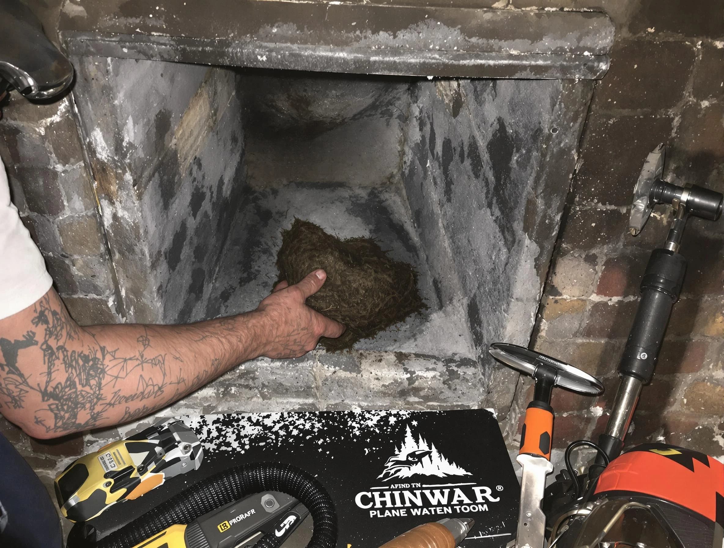 Vestavia Hills Chimney Sweep safely removing debris and screening chimney in Vestavia Hills, AL